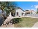 Spacious backyard with grassy lawn, providing ample space for recreation at 38169 N Rusty Ln, San Tan Valley, AZ 85140