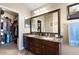 Double vanity bathroom with granite countertop and walk-in closet at 38169 N Rusty Ln, San Tan Valley, AZ 85140