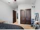 Cozy bedroom with double door closet and adjacent bathroom at 38169 N Rusty Ln, San Tan Valley, AZ 85140