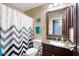 Clean bathroom with shower/tub combo and granite vanity at 38169 N Rusty Ln, San Tan Valley, AZ 85140