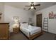 Cozy bedroom with a wooden bed frame and neutral decor at 11717 E Estrella Ave, Scottsdale, AZ 85259