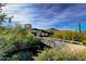 Contemporary home nestled in the desert landscape with a walkway bridge at 10801 E Happy Valley Rd # 132, Scottsdale, AZ 85255