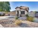 Tan two-story house with brown garage door and nicely landscaped yard at 7216 W Judy Lynn Ln, Peoria, AZ 85382