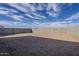 Empty lot with block wall and blue sky at 17978 W Long Lake Rd, Goodyear, AZ 85338