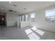 Spacious bedroom with multiple windows and city views at 17978 W Long Lake Rd, Goodyear, AZ 85338