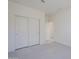 Bedroom with double door closet and access to bathroom at 17978 W Long Lake Rd, Goodyear, AZ 85338