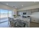 Modern kitchen with gray cabinets, marble countertops, and stainless steel appliances at 17978 W Long Lake Rd, Goodyear, AZ 85338