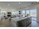 Modern kitchen with gray cabinets, marble countertops, and stainless steel appliances at 17978 W Long Lake Rd, Goodyear, AZ 85338