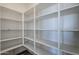 Spacious pantry with ample shelving for storage at 17978 W Long Lake Rd, Goodyear, AZ 85338