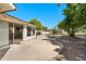 Spacious backyard patio with gravel landscaping and golf course view at 8128 E Emelita Ct, Mesa, AZ 85208