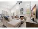 Spacious living room featuring a sectional sofa, fireplace, and large TV at 9056 E Maple Dr, Scottsdale, AZ 85255