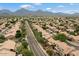 Neighborhood view showcasing many homes with mountain backdrop at 9056 E Maple Dr, Scottsdale, AZ 85255