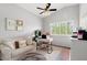 Comfortable home office space with a desk, chair, and plush sofa at 9056 E Maple Dr, Scottsdale, AZ 85255