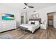 Spacious main bedroom with plush bed and en-suite bathroom access at 9056 E Maple Dr, Scottsdale, AZ 85255