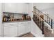 Convenient wet bar with ample storage and cabinetry at 9056 E Maple Dr, Scottsdale, AZ 85255