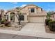 Beautiful two-story home with tan exterior and landscaped yard at 9056 E Maple Dr, Scottsdale, AZ 85255