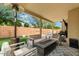 Relaxing backyard oasis with covered patio, fire pit, and pool at 9056 E Maple Dr, Scottsdale, AZ 85255