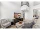 Bright living room with vaulted ceilings and cozy seating area at 9056 E Maple Dr, Scottsdale, AZ 85255