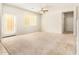 Spacious living room with carpet and neutral walls at 913 E Agua Fria Ln, Avondale, AZ 85323