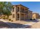 Two-story house with balcony and landscaped front yard at 913 E Agua Fria Ln, Avondale, AZ 85323