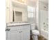 Bathroom with white vanity, toilet, and bathtub at 913 E Agua Fria Ln, Avondale, AZ 85323