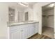 Double vanity bathroom with ample counter space and a large mirror at 913 E Agua Fria Ln, Avondale, AZ 85323