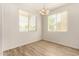 Bright dining room with wood flooring and window at 913 E Agua Fria Ln, Avondale, AZ 85323