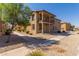 Two story home with balcony and desert landscaping at 913 E Agua Fria Ln, Avondale, AZ 85323