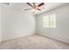 Well-lit bedroom featuring a ceiling fan and carpet at 913 E Agua Fria Ln, Avondale, AZ 85323