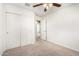 Bedroom with double door closet and access to another room at 913 E Agua Fria Ln, Avondale, AZ 85323