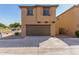 Two-car garage with residential home above at 913 E Agua Fria Ln, Avondale, AZ 85323