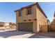 Tan two-story home with a two car garage at 913 E Agua Fria Ln, Avondale, AZ 85323