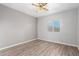 Bedroom featuring wood-look floors and window coverings at 441 E Saratoga St, Gilbert, AZ 85296