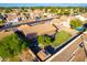 Aerial view of house and neighborhood, showcasing a large backyard and community at 441 E Saratoga St, Gilbert, AZ 85296