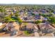 Aerial view of property and surrounding homes with pool and large backyard at 441 E Saratoga St, Gilbert, AZ 85296