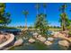 Community water feature with waterfall and palm trees at 1243 E Artesian Way, Gilbert, AZ 85234