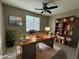 Home office with built-in shelving, a large desk and neutral decor at 23302 N 40Th Pl, Phoenix, AZ 85050