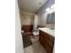 Bathroom with wood vanity, shower/tub combo, and tile flooring at 4330 W Mescal St, Glendale, AZ 85304