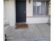 Black metal front door with welcome mat at 4330 W Mescal St, Glendale, AZ 85304