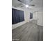 Bedroom with mirrored closet doors and gray flooring at 4330 W Mescal St, Glendale, AZ 85304