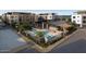 Community pool and clubhouse with lounge chairs and modern architecture at 19360 N 73Rd St # F, Scottsdale, AZ 85255