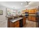 Well-equipped kitchen featuring wood cabinets and modern appliances at 14588 W Laurel Ln, Surprise, AZ 85379
