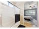 Clean bathroom with tub/shower combo and view into bedroom at 14588 W Laurel Ln, Surprise, AZ 85379