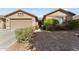 Two-car garage and well-maintained landscaping at 14588 W Laurel Ln, Surprise, AZ 85379