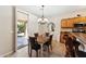 Kitchen dining area with patio access and chandelier at 14588 W Laurel Ln, Surprise, AZ 85379