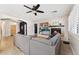 Bright living room showcasing a fireplace and comfortable seating at 14588 W Laurel Ln, Surprise, AZ 85379