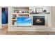 Modern fireplace with built-in shelving and TV niche at 14588 W Laurel Ln, Surprise, AZ 85379