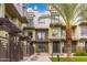 Modern building exterior with palm trees and walkway at 7788 E Main St # 1002, Scottsdale, AZ 85251