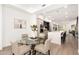 Bright dining area with glass table and four chairs, adjacent to modern kitchen at 7788 E Main St # 1002, Scottsdale, AZ 85251