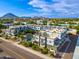 Aerial view of a modern building complex with a pool and landscaping, situated in a vibrant urban area at 7788 E Main St # 1002, Scottsdale, AZ 85251